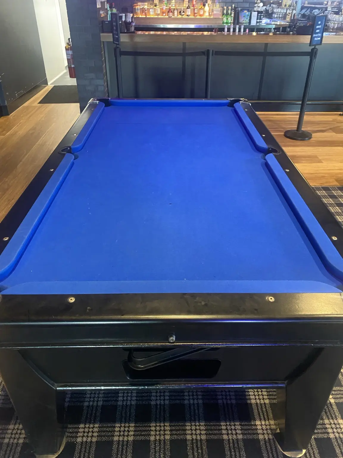 Blue cloth pool table after reclothing