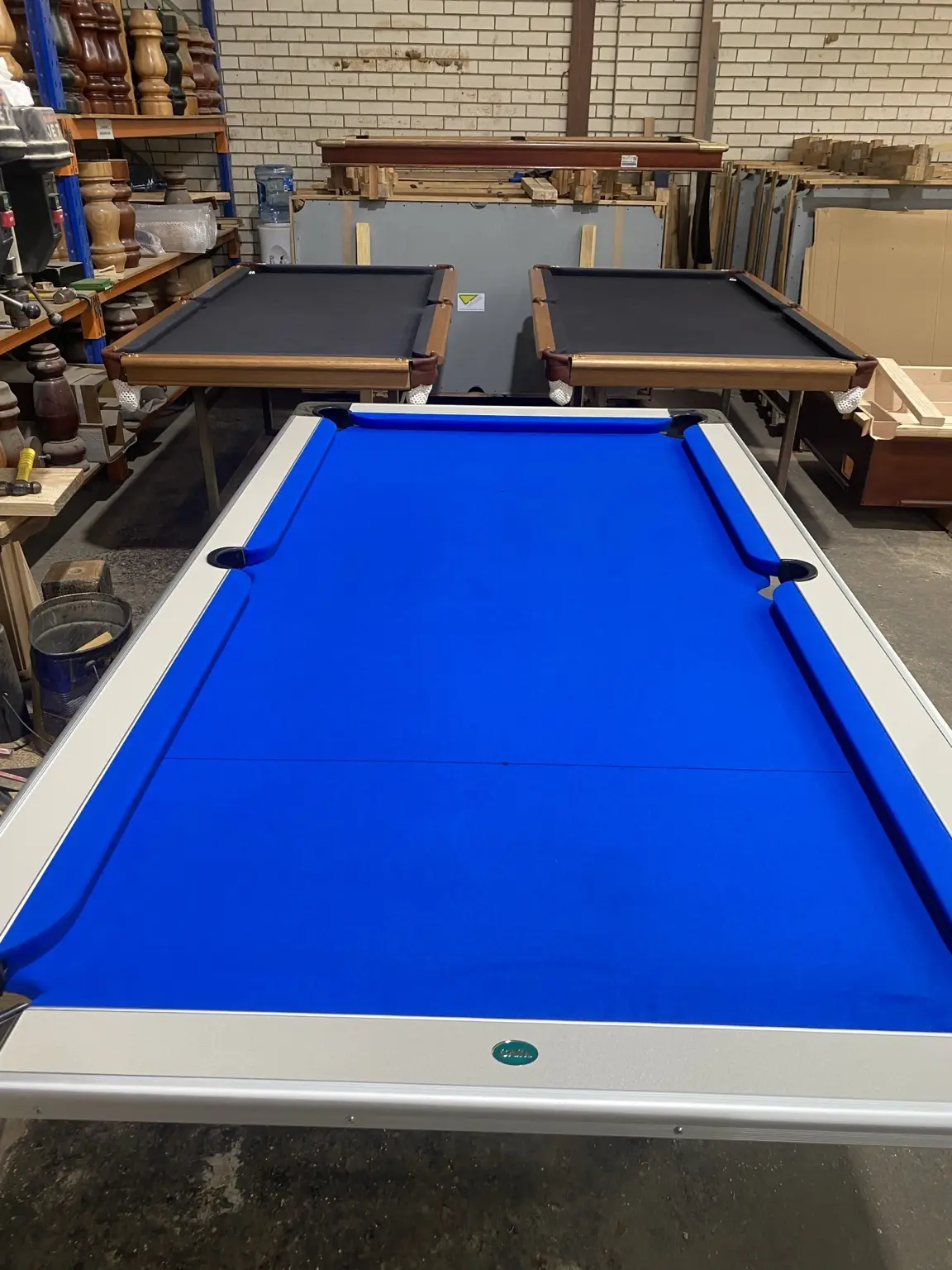 Blue pool table in workshop